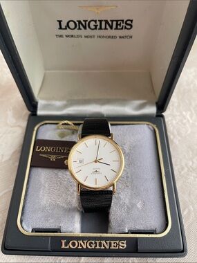 Vintage Longines Men’s Gold Case Watch with White Dial and Black Strap